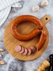 Wall Mural - fresh homemade sausage on a light background with vegetables