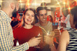 © JackF - Happy women and men clinking glasses at night club. High quality photo