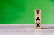 © daily_creativity - Cube block with word TAX. Finance concept. Copy space