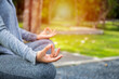 © OMEGA - Young yoga woman meditation on the ocean beach at amazing sunset. Woman Yoga - relax in nature.