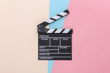 Movie Clapper Board On Colored Pastel Background. Cinema Industry, Entertainment. Top View