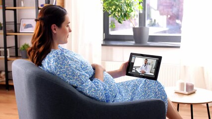 Wall Mural - pregnancy, technology and medicine concept - happy pregnant woman with tablet pc computer having video call with doctor at home