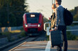 © Johnér - Couple waiting at train station platform