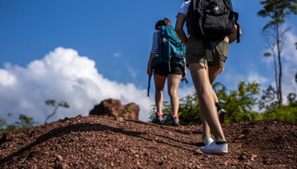 group of asian female walking by hiking trail .