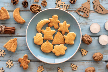 Wall Mural - Christmas background with homemade Christmas cookies on wooden background. Top view.