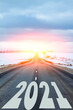 © Oleg - New year theme. The year 2021 is written on the road. All the good is ahead.