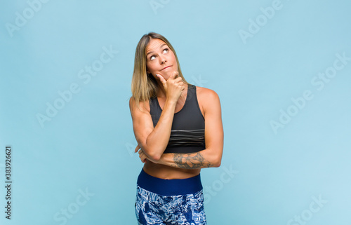 Cuadros en Lienzo young pretty woman thinking, feeling doubtful and confused, with different options, wondering which decision to make