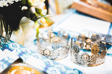 Golden crowns lying on the table in church