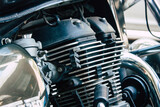 Fototapeta  - Closeup of a motorcycle parked in the streets of the city center of the metropolitan area

