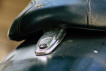 Closeup of a motorcycle parked in the streets of the city center of the metropolitan area
