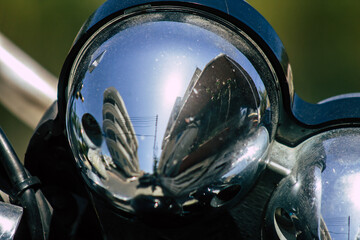 Closeup of a motorcycle parked in the streets of the city center of the metropolitan area
