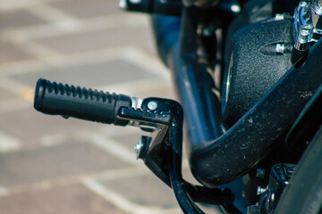 Canvas Print - Closeup of a motorcycle parked in the streets of the city center of the metropolitan area
