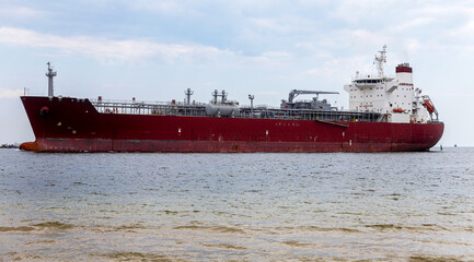 An unloaded sea cargo ship enters the Yuzhny sea trade port of Odessa Ukraine to load industrial cargo for international industrial transport. Forvater seaport with ship