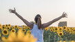 © Irene - Happy woman in sunflowers field