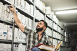 © Antonio Recena - Man works in archive and reviews the different files