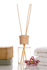 aroma therapy objects. bottle of esential oil, candle, towels, soap