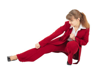 Woman in red business suit kicks