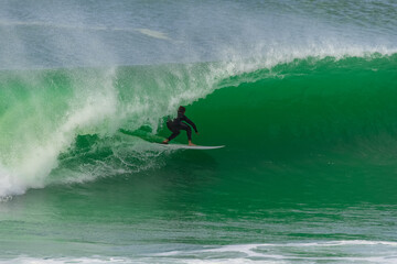 Wall Mural - Surfer in a big wave, Anglet in the pays basque, France
