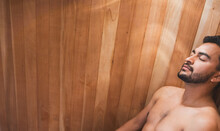 Young Handsome Man In Sauna At Spa Center