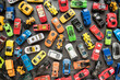 Overhead view on colorful car toys. Many multi-colored.