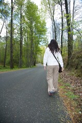 Wall Mural - woman on a rural road