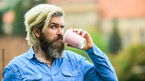 Tastes delicious. good morning inspiration. brutal man with beard drinking tea from cup. bearded man drink coffee outdoor. hipster relax in park. mature traveler having rest. take away coffee