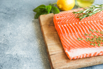 Wall Mural - Salmon. Fresh raw salmon fish fillet with cooking ingredients, herbs and lemon. Close up. healthy food, diet or cooking concept