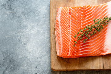 Wall Mural - Salmon. Fresh raw salmon fish fillet with cooking ingredients, herbs and lemon. Close up. healthy food, diet or cooking concept