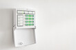 © Nataliia - Electronic control panel of the apartment and office security alarm system with electronic keypad on a white wall