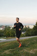 © Anischenko - Young man running outdoors, at sunset, staying active