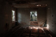This is an interior of a bedroom that has been stripped of its flooring and is down to its wood joists at a long-abandoned house in Virginia.