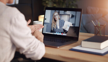 Back view of impersonalized person having distant communication with business partner through video call