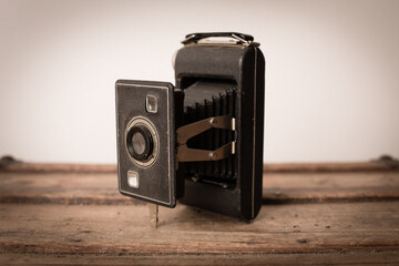 Vintage Film Camera on Old Wooden Trunk