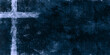 light cross on dark blue textured painting background with copy space