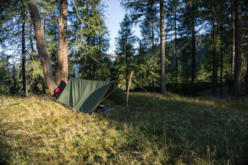 Sleeping outdoors underneath a tarp