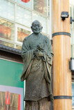 Fototapeta Paryż - A statue of Gyoki Bosatsu in front of the train station in Nara, Japan