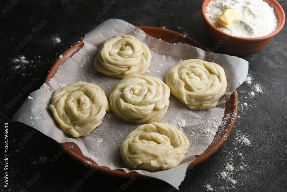 Parotta Rings Making preparing of dough Indian flatbread bakery products. Maida or ...