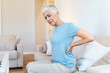 © Graphicroyalty - Upset mature middle aged woman feels back pain massaging aching muscles, sad senior older lady suffers from low-back lumbar pain sitting in incorrect sedentary posture, backache radiculitis concept
