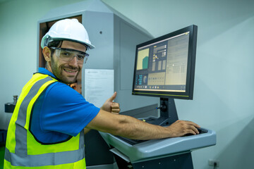 Poster - Engineer mechanic use laptop working and checking machine in a large industrial factory.