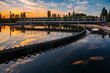 © Mulderphoto - Modern sewage treatment plant. Round wastewater purification tanks at sunset.