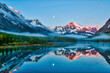 Mirrored Sunrise Lake Showing Moon and Glacier National Park Mountains