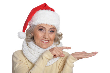 Poster - Portrait of smiling happy senior woman in Santa hat posing