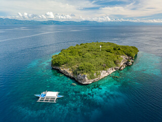 Philippino banca style boat parked near Pescador Island near Moalboal.