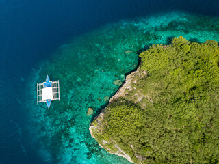 Philippino banca style boat parked near Pescador Island near Moalboal.