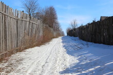 Snow Trail Between Fences In Winter