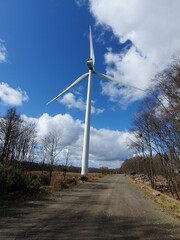 Scottish wind turbine in Fife with blue sky and clouds