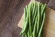 green beans on a wooden board