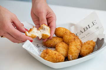 Tapas plate of Spanish ham and cheese croquettes with onions