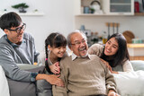 Fototapeta Boho - Happy multigenerational asian family portrait in living room