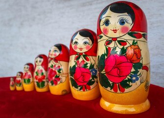 Russian nesting dolls, stacking dolls Isolated on white and red background